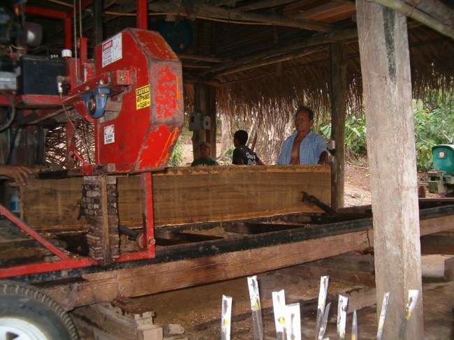 IAF staff converting plantation lumber into boards